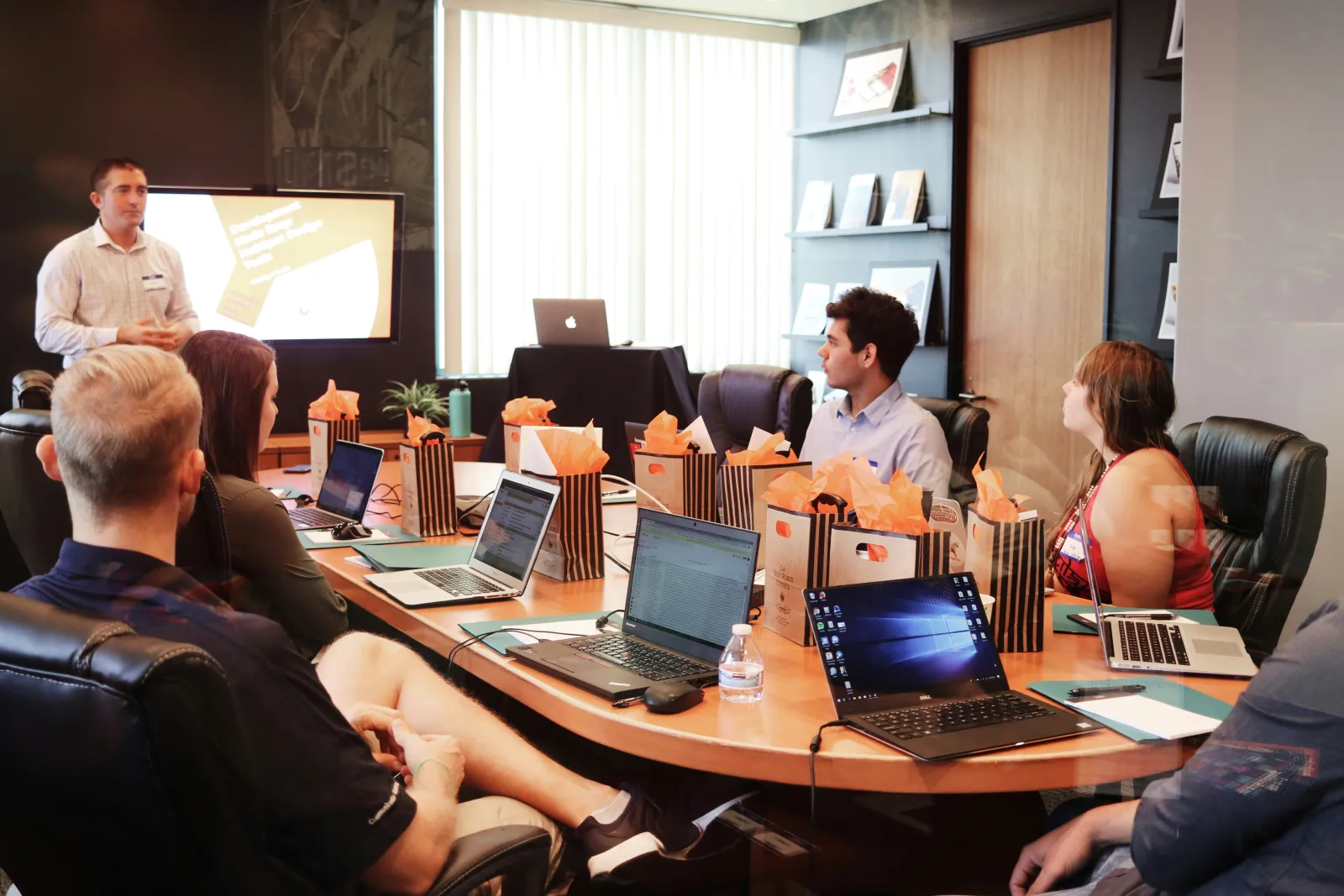 Corporate team watching a training video in a conference room